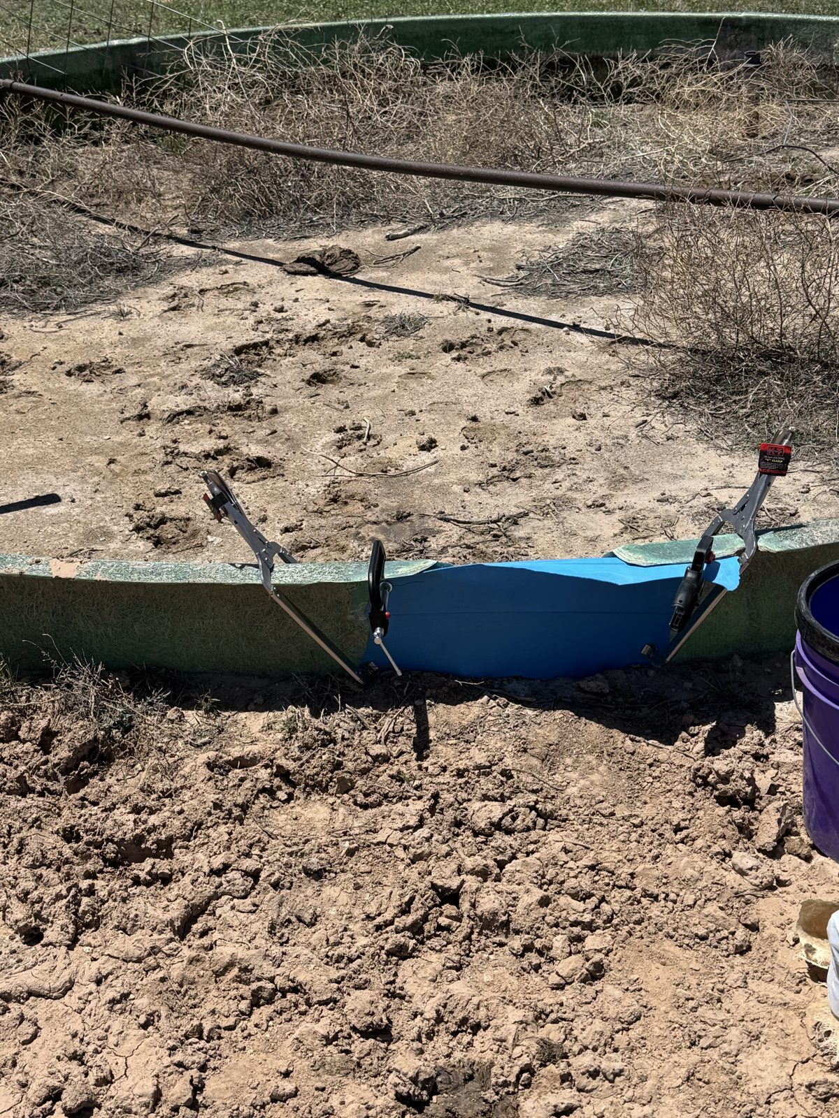 Stock tank repair on the Ellison ranch, Texas Panhandle